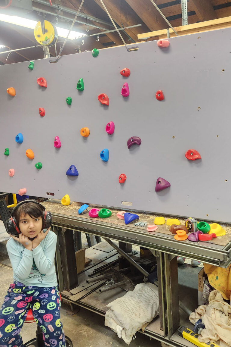 climbing wall under construction, Jr. Helper on duty!