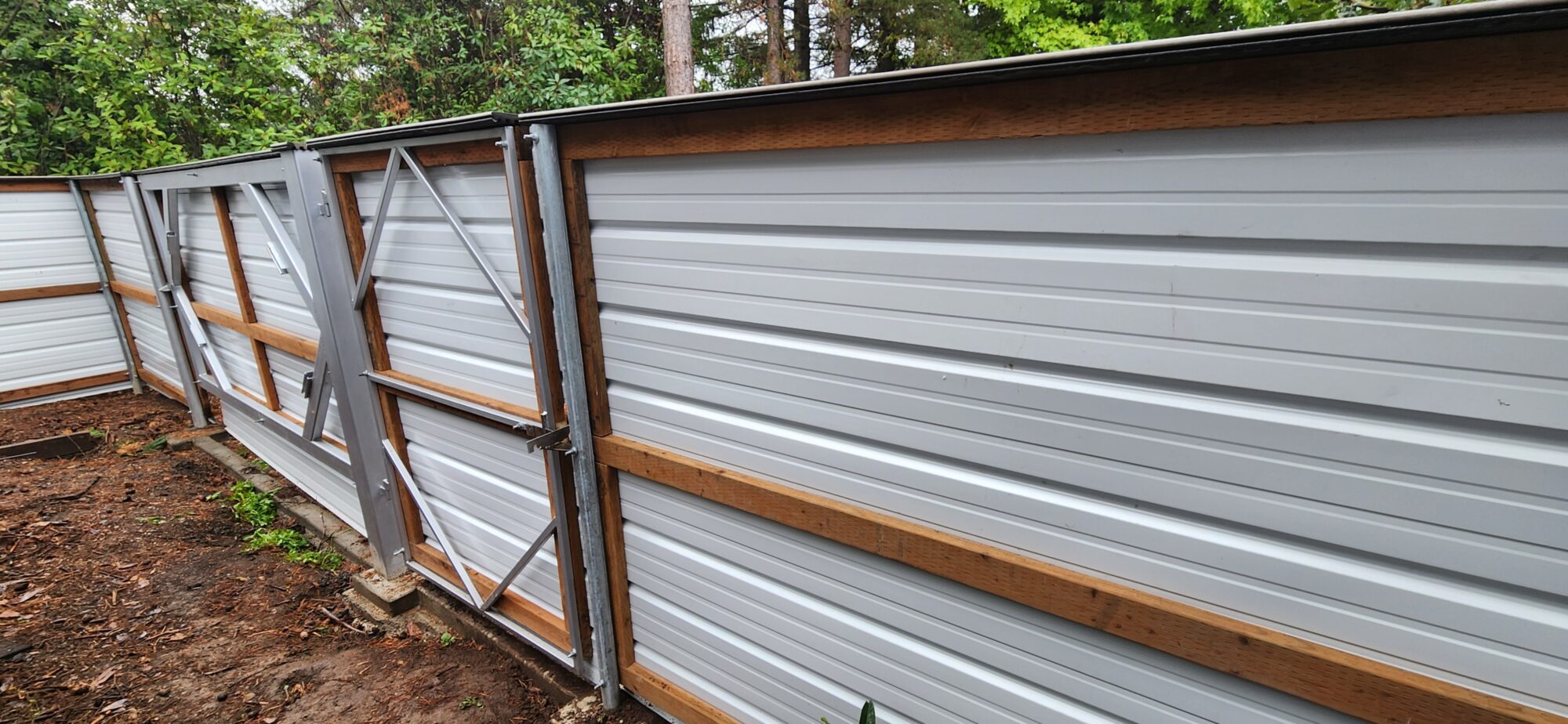 back view of completed fence and man gate